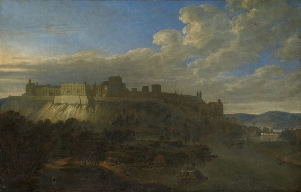 Der Blick auf die Burg Windsor Castle, die sich auf einem Felsen hinter einer Landschaft erhebt.